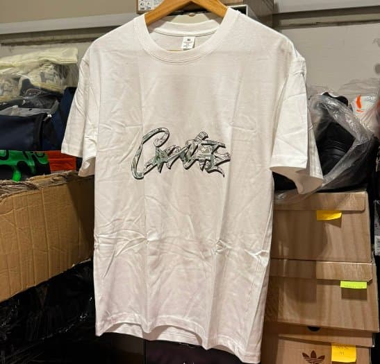 REMERA CORTEIZ BLANCA LOGO DOLAR de Corteiz